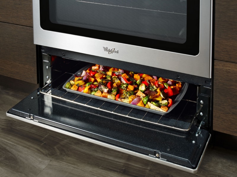 Vegetables roasting in under-oven broiling drawer
